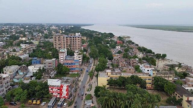 An aerial view of Rajshahi showing the city skyline along the Padma River.