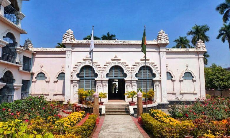 Tourists visiting the Varendra Research Museum in Rajshahi with historic architecture and surrounding streets.