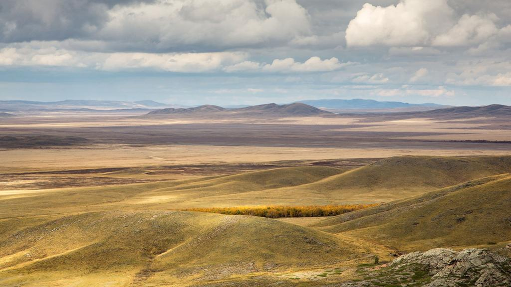Wide-open steppe landscape in Kazakhstan.