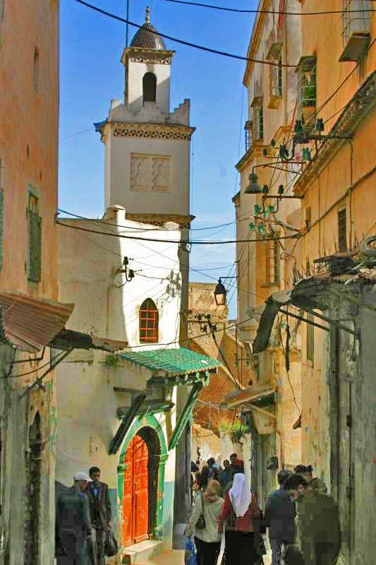 Narrow stone streets lined with historic buildings in the Casbah of Algiers.