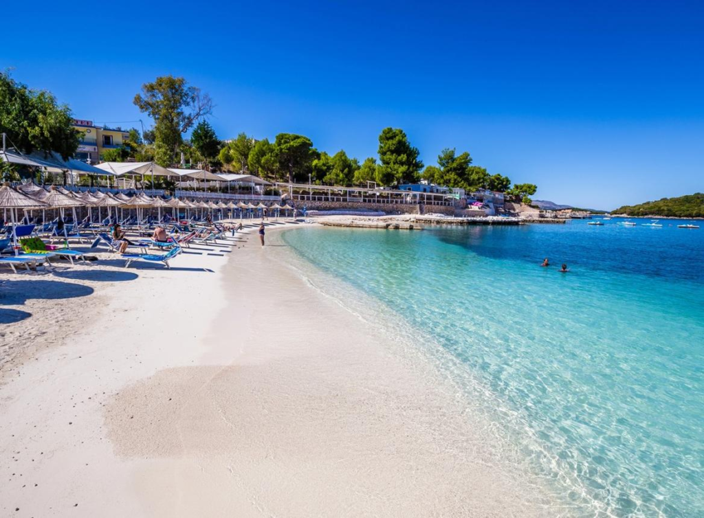 Crystal-clear turquoise water and white sand beaches along the Albanian Riviera at Ksamil.