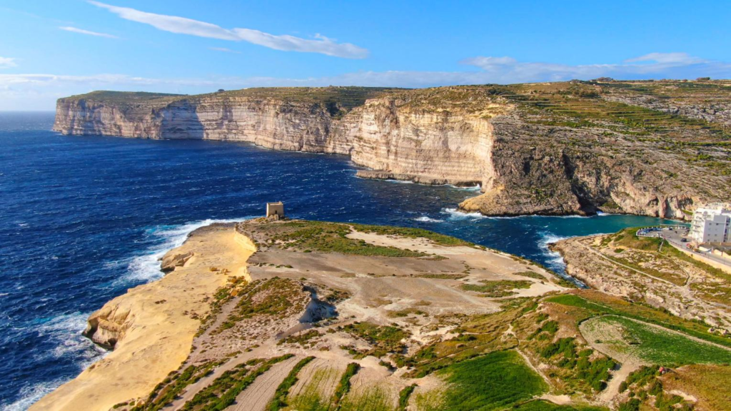 Scenic coastal cliffs and beaches on Gozo Island, Malta.