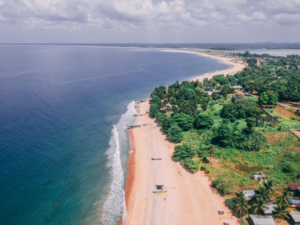 Sandy beach and waves at Robertsport, Liberia.