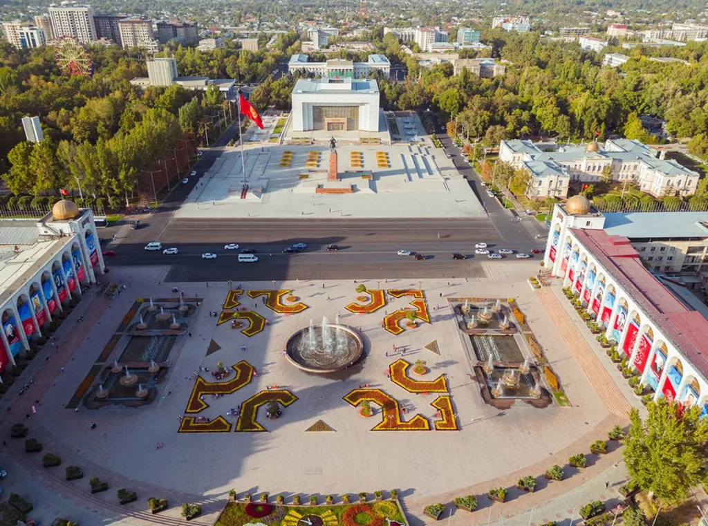 Ala-Too Square in Bishkek with monuments and government buildings.