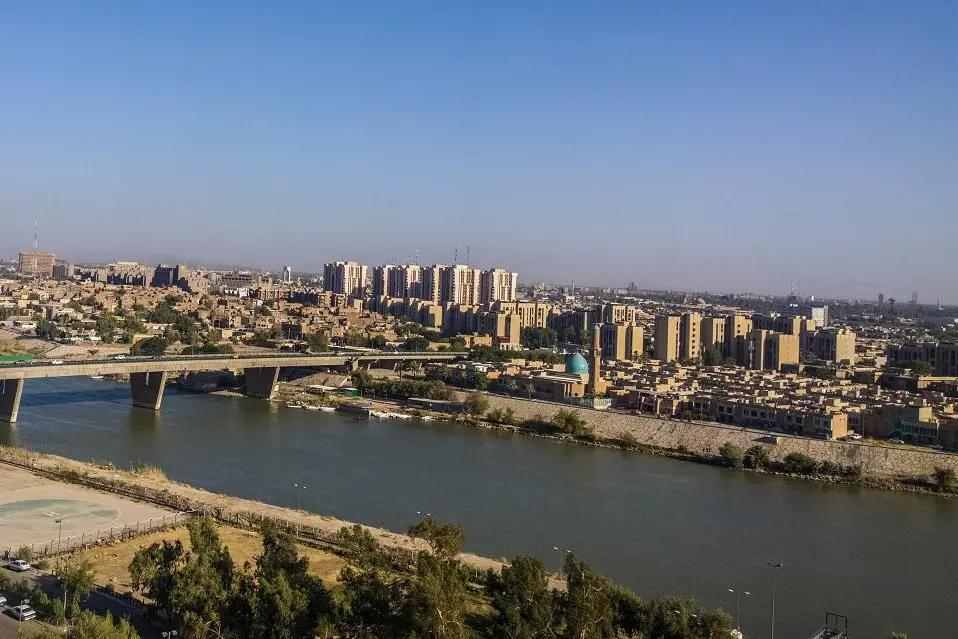 Baghdad city skyline beside the Tigris River in Iraq.