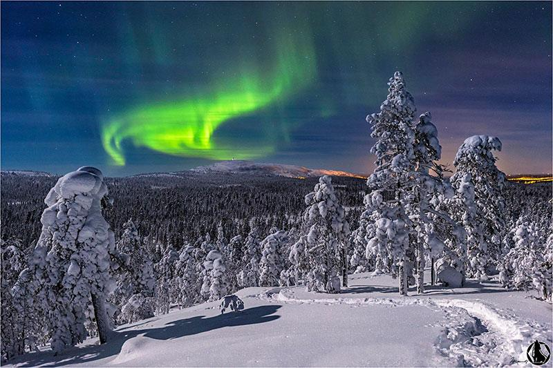 Northern lights over Finnish Lapland wilderness.